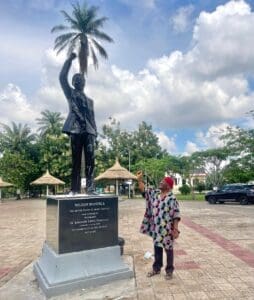 Celebrating the United Nations' Mandela Day with the 'Desert Warrior' 14 Dr Newton Jubunoh by the Nelson Mandela statue at the Nelson Mandela Garden Asaba 1